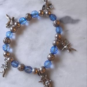 Blue silvertone cherub charm bracelet